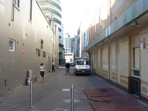 The current view of Henrietta Lane looking north towards Raglan Street &ndash; dominated by concrete walls and storage areas
